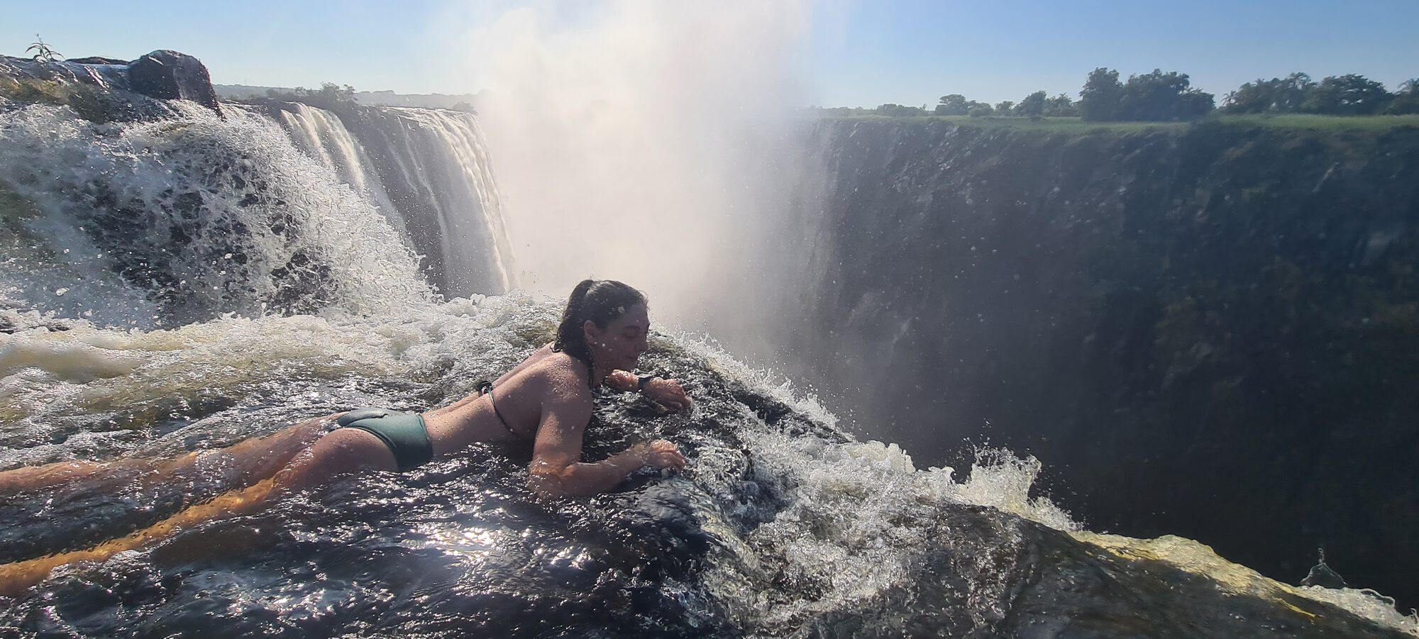 Kelly swimming at Devil's Pool, at the very edge of Victoria Falls, Zambia