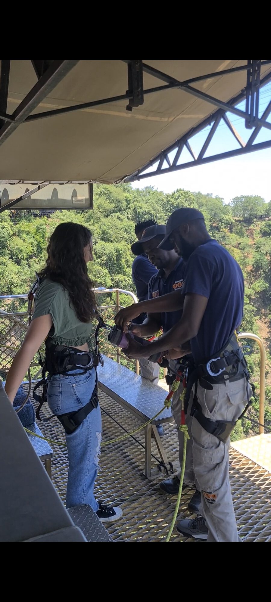 Client being harnessed for the Victoria Falls bridge bungee jump